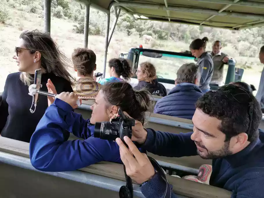 Bespoke open safari vehicle exploring valley terrain